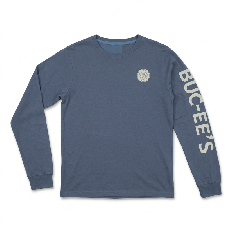 Buc-ee’s long-sleeve shirt in slate blue with small beaver chest logo and cream lettering down the sleeve