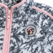 Close-up of the Buc-ee the Beaver patch and pink zipper on the snow camo fleece
