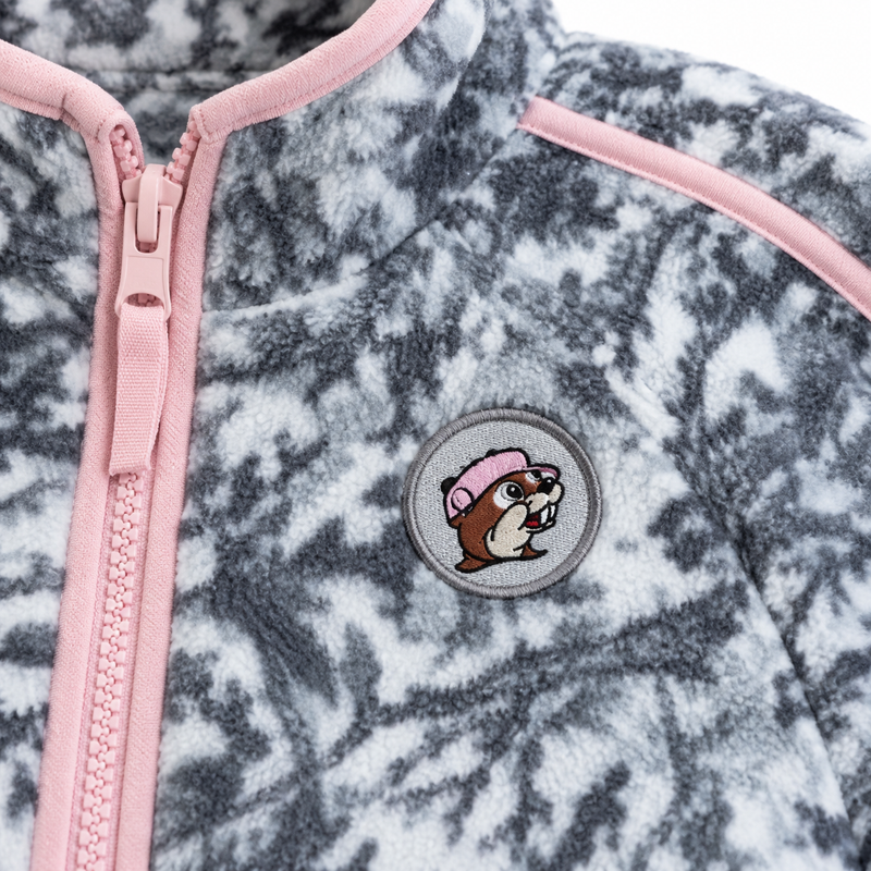 Close-up of the Buc-ee the Beaver patch and pink zipper on the snow camo fleece