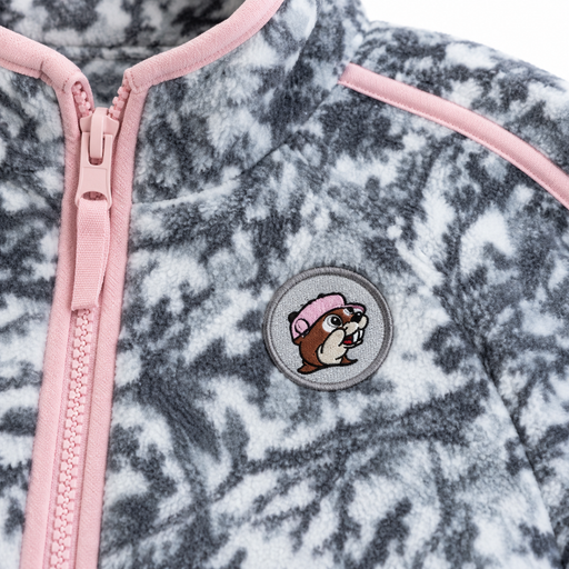 Close-up of the Buc-ee the Beaver patch and pink zipper on the snow camo fleece