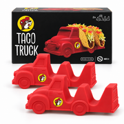 Buc-ee's Taco Truck 2-pack retail box in black with the beaver logo and "TACO TRUCK" lettering, with the two red silicone truck taco holders in front, on a white background.
