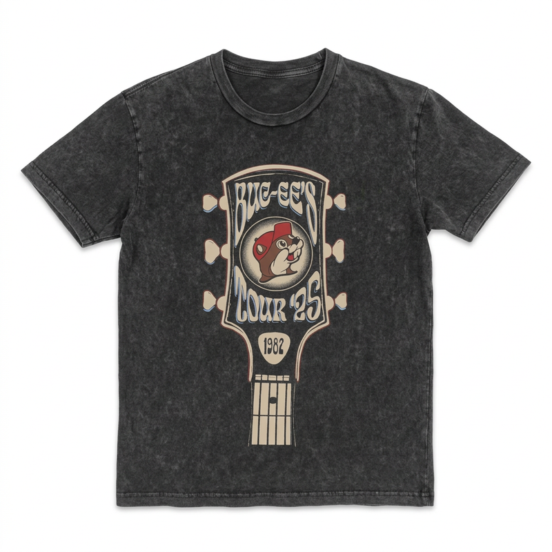 Buc-ee’s Tour ‘25 T-shirt in charcoal mineral wash with a retro guitar headstock graphic and beaver logo, front view