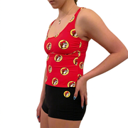 Buc-ee’s women’s red logo tankini top on a model at an angle, showing the side fit with black logo swim shorts