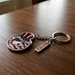 Keychain with American flag design on a wooden surface
