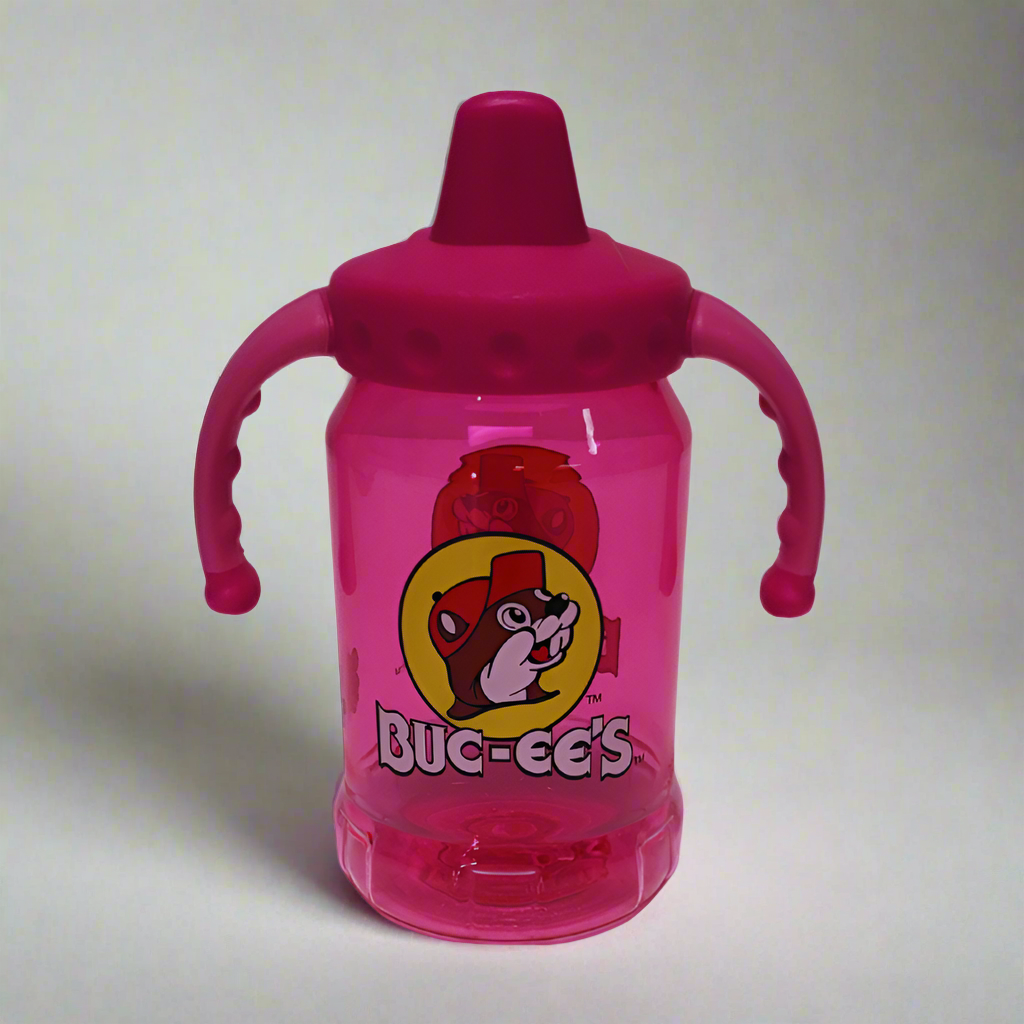 a pink sippy cup with the bucees logo on the front