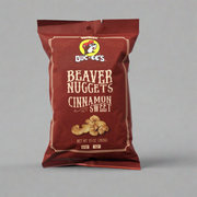 A package of Buc-ee's Beaver Nuggets Cinnamon Sweet snack. The packaging is predominantly red with an image of the cinnamon nuggets on the front.