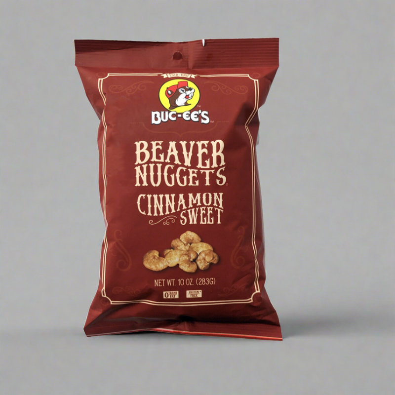 A package of Buc-ee's Beaver Nuggets Cinnamon Sweet snack. The packaging is predominantly red with an image of the cinnamon nuggets on the front.