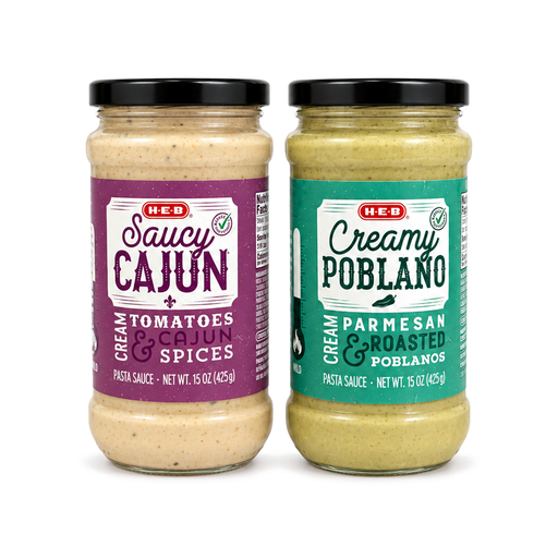 H-E-B Saucy Cajun and Creamy Poblano cream pasta sauces in 15 oz glass jars, made with Cajun spices and roasted poblanos