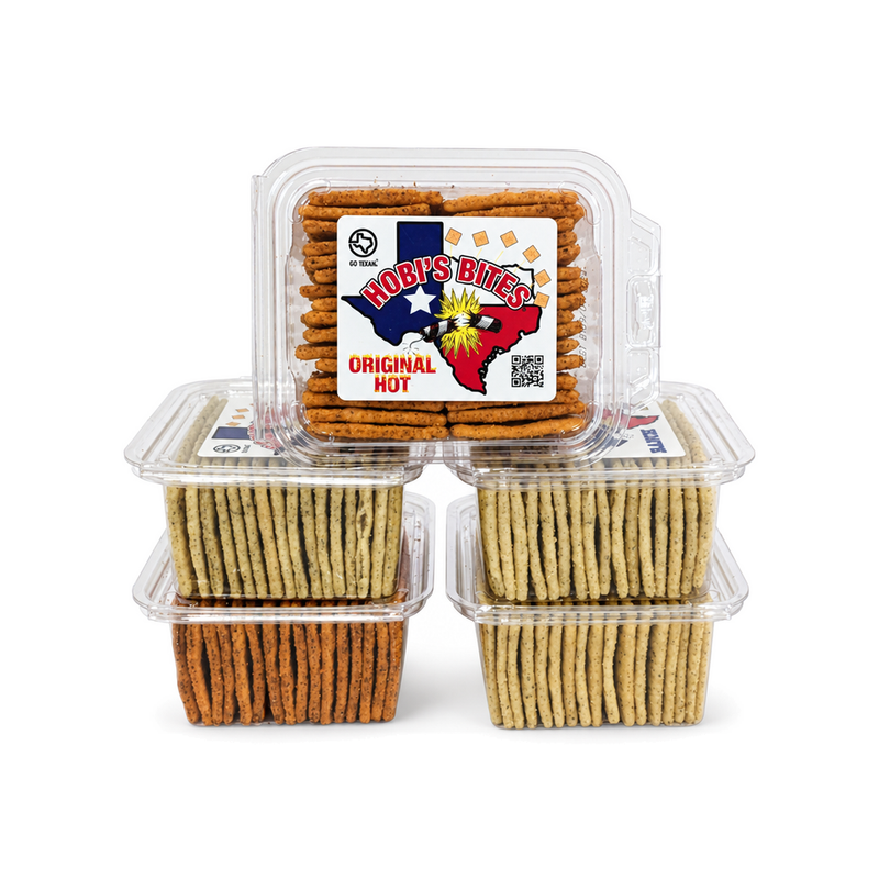 Hobi's Bites seasoned crackers in five clear clamshell containers stacked together