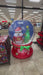 Video showing a Buc-ee’s Christmas snow globe inflatable displayed in a store, featuring Buc-ee the Beaver in a Santa outfit next to a Christmas tree with falling snow inside the globe.