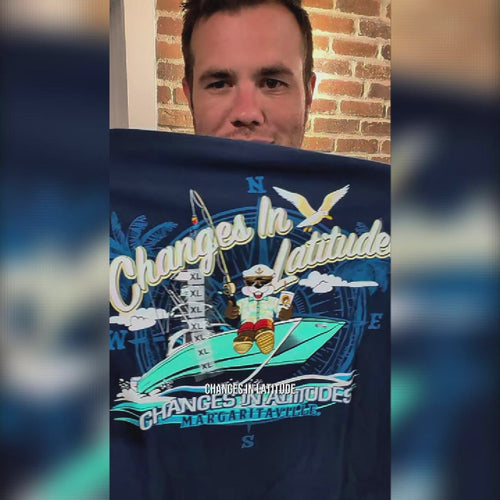Buc-ee’s Margaritaville Latitudes blue shirt review featuring a nautical design with a ship and compass-inspired details.