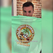Buc-ee’s lime green Margaritaville shirt review featuring a chest palm tree logo, a large “Brisket Sandwich in Paradise” back print, and unisex adult sizing from Small to 3X.