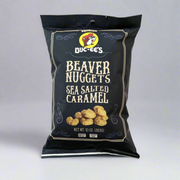 A package of Buc-ee's Beaver Nuggets Sea Salted Caramel snack. The black package features the brand logo and a picture of the caramel nuggets.
