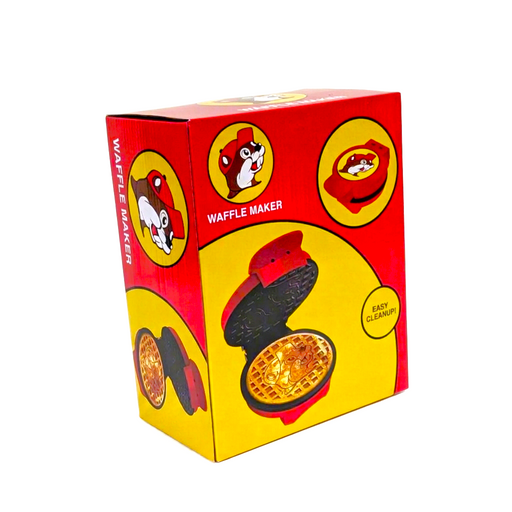 Buc-ee’s waffle maker in a red and yellow box showing the red appliance and a waffle stamped with the beaver face