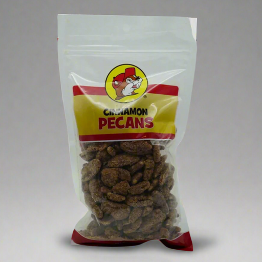 A clear plastic bag packaging displaying cinnamon pecans with the brand logo at the top.