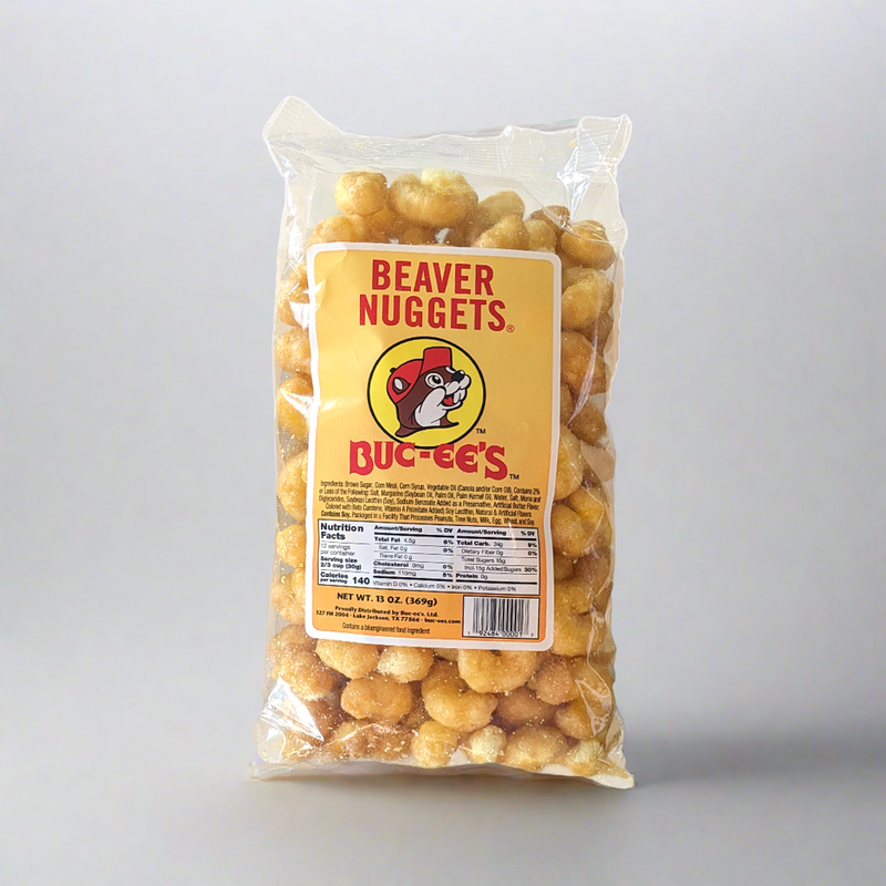A pack of Buc-ee's Beaver Nuggets, a sweet corn puff snack, with the brand logo and product information displayed on the front.
