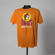 Orange Buc-ee's Denton, TX location shirt with Buc-ee the Beaver logo on a mannequin